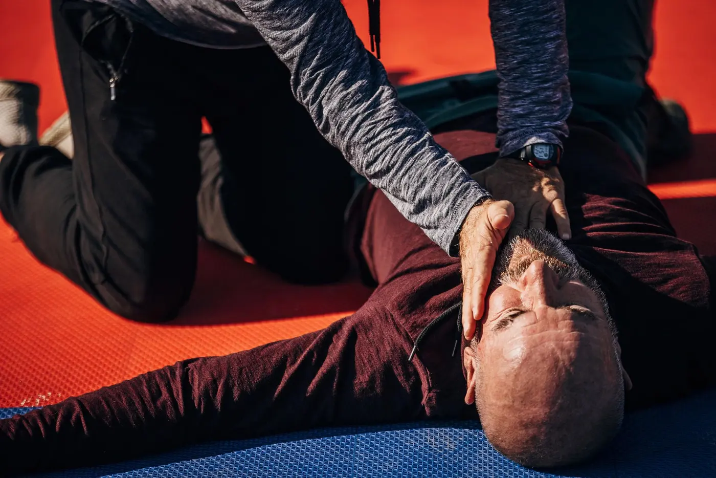 First aid instructor demonstrating the recovery position